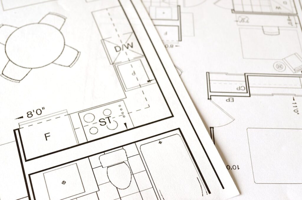 pexels photo 271667 Close-up view of an architectural floor plan on paper showcasing detailed room layouts and measurements.